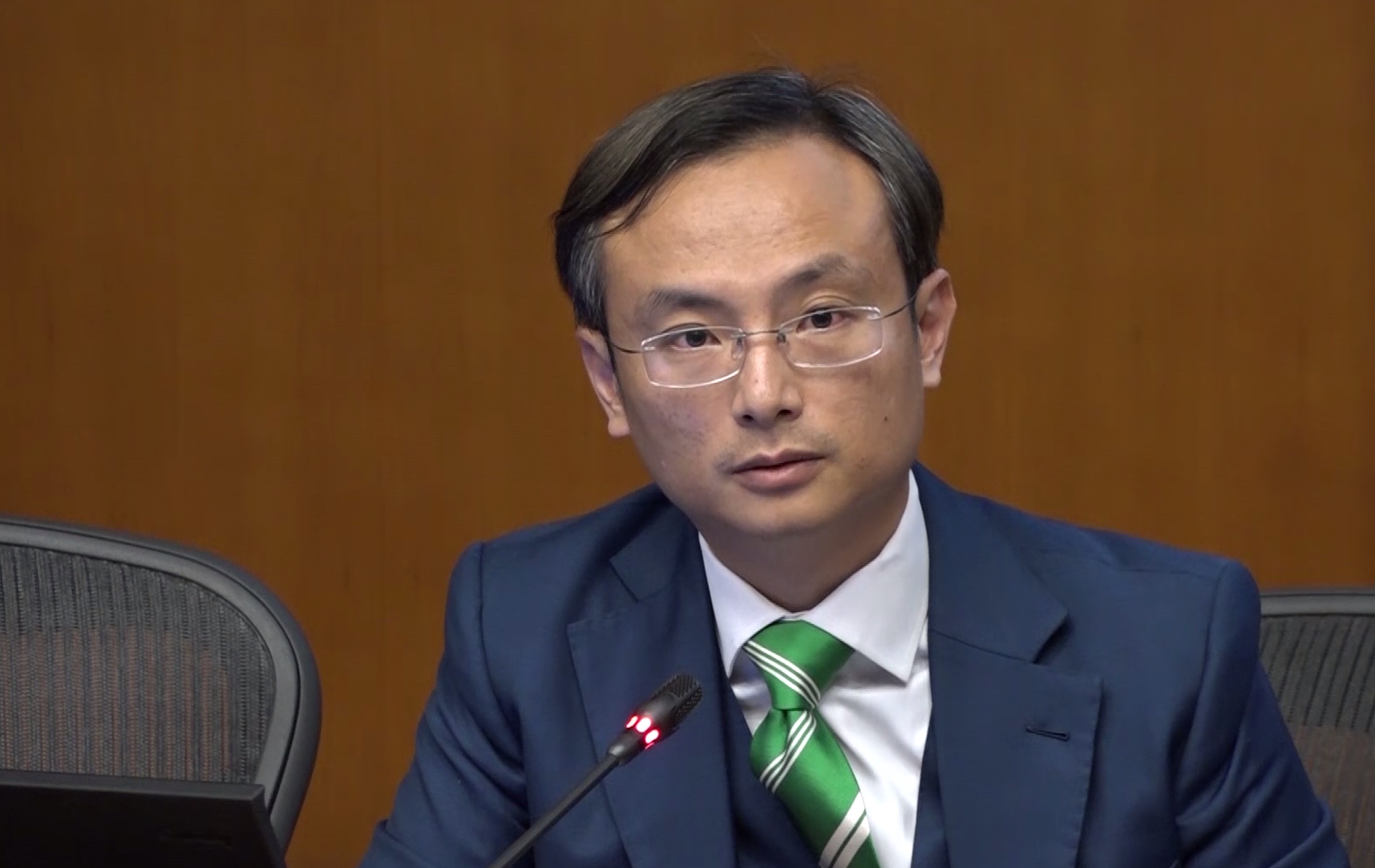 Lawmaker Pierre Chan tells members of the press about a secret backdoor that allowed police to access patients’ hospital records. Screengrab via RTHK.