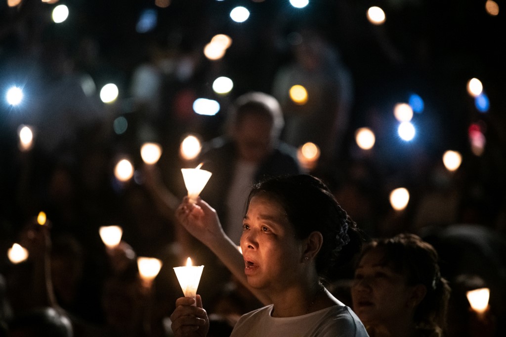 People hold candles at the vigil at Victoria Park on June 4, 2019. Photo (for illustration): AFP