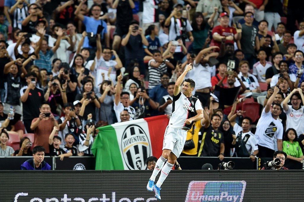 Juventus' Cristiano Ronaldo celebrates scoring during the International Champions Cup football match between Juventus and Tottenham Hotspur in Singapore on July 21, 2019. (Photo by Roslan RAHMAN / AFP)
