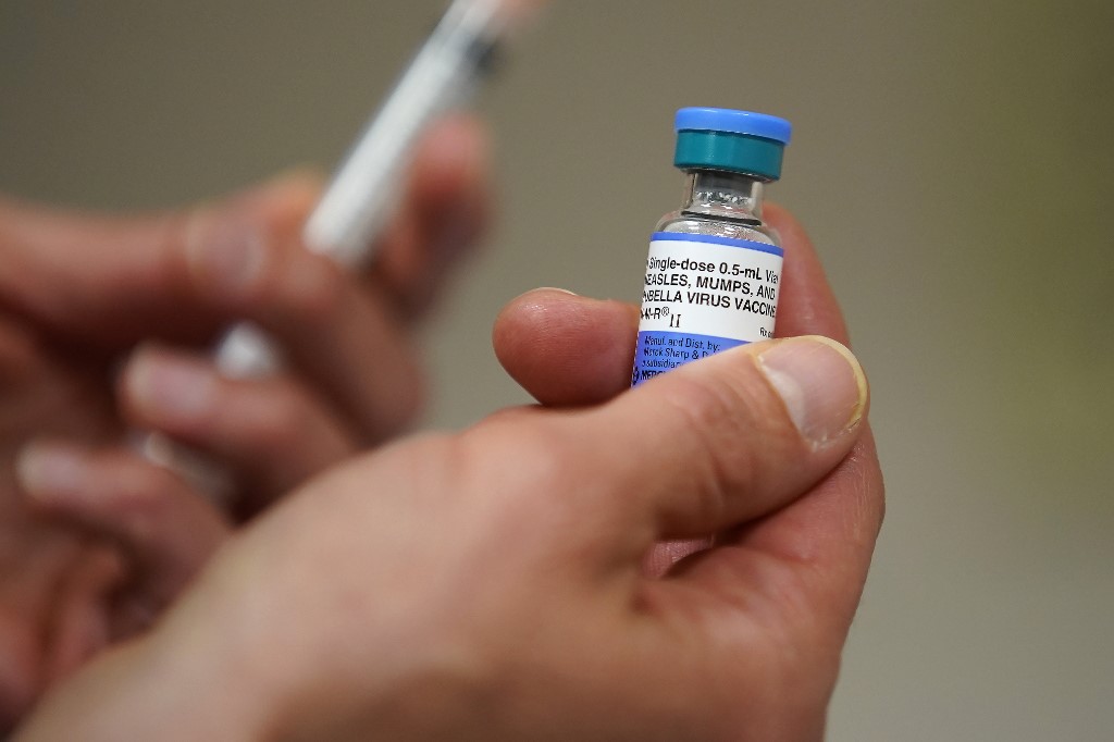 SALT LAKE CITY, UT – APRIL 26: In this photo illustration a one dose bottle of measles, mumps and rubella virus vaccine, made by MERCK, is held up at the Salt Lake County Health Department on April 26, 2019 in Salt Lake City, Utah. (Photo Illustration by George Frey/Getty Images)
