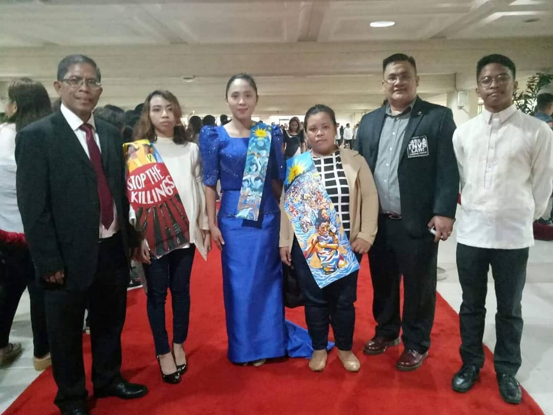Representative Sarah Elago and her guests wearing their protest sashes before they were confiscated. <i></noscript>Photo: Elago’s FB</i>