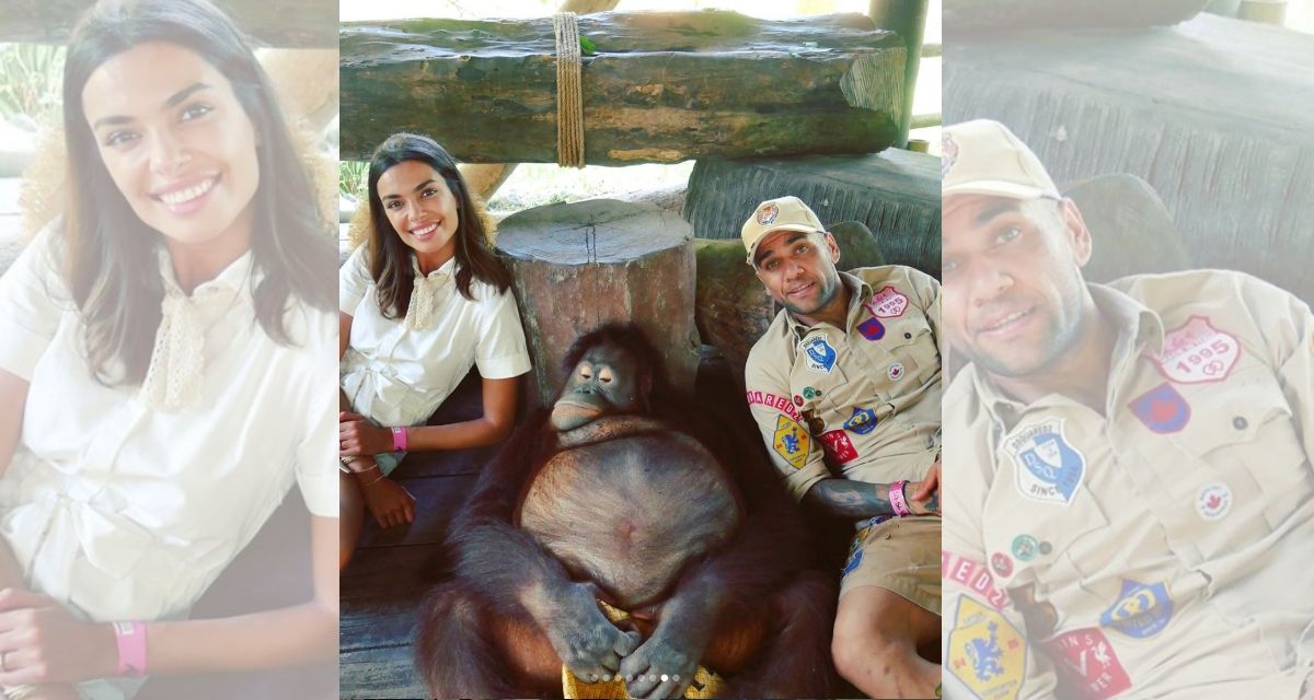 Spanish model Joana Sanz and Brazilian pro soccer player Dani Alves pose with an orangutan at Bali Safari and Marine Park. (Photo: Dani Alves / Instagram)