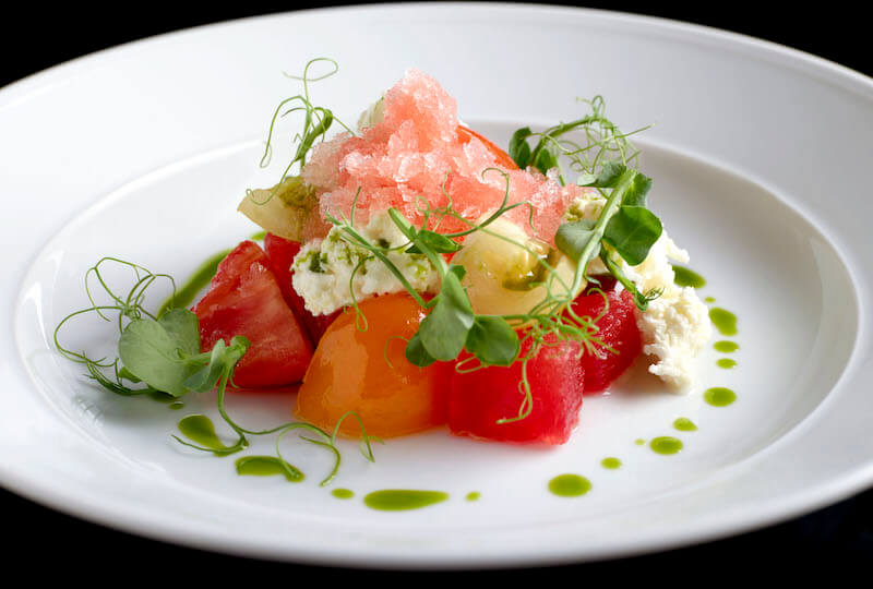Vine tomatoes and mixed melon. Photo: Cook & Tras