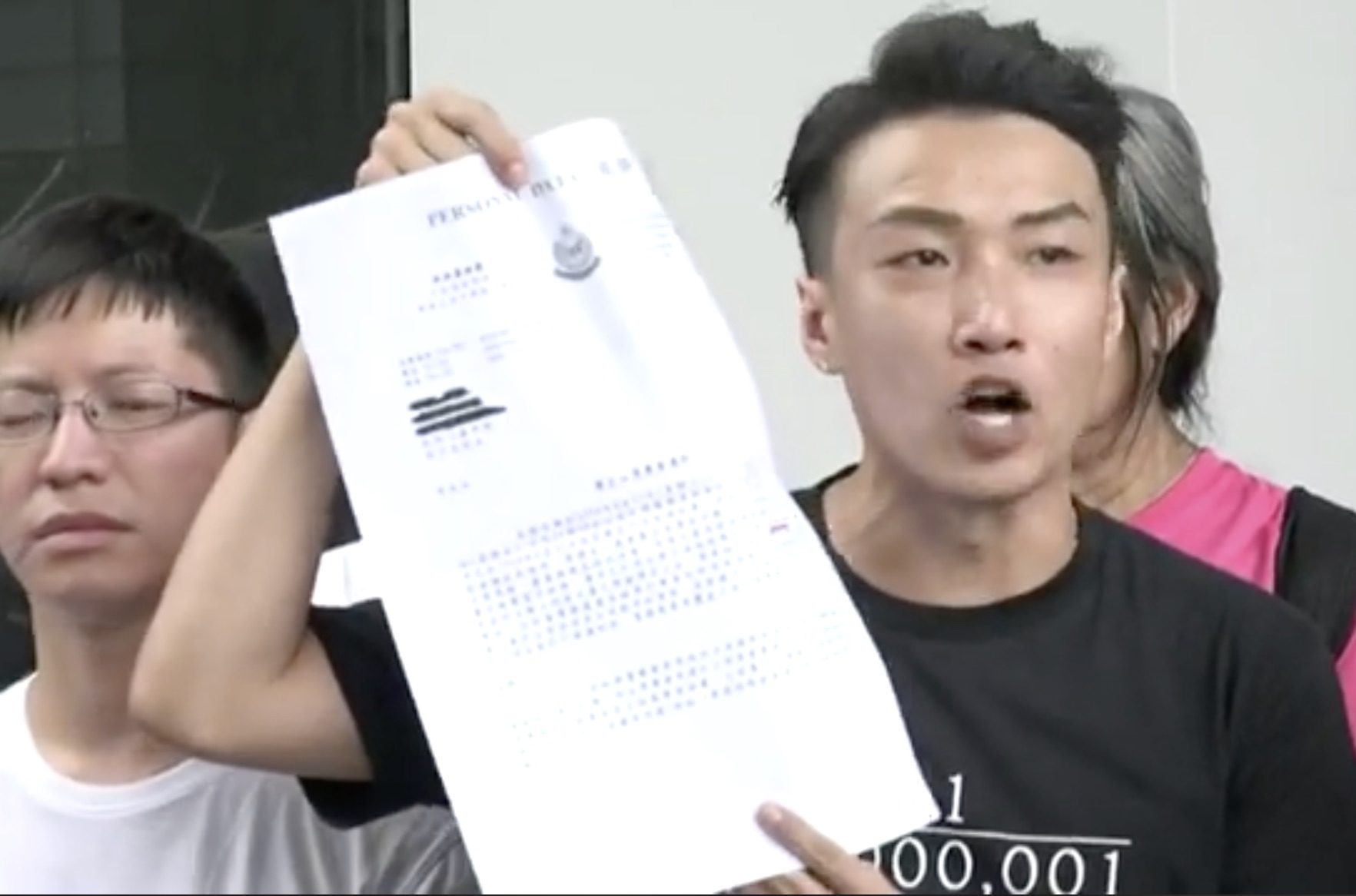 Jimmy Sham, the convenor of the Civil Human Rights Front, holds up a police letter of objection classifying the June 12 rally as a riot, and accused Carrie Lam of lying after she claimed in a press conference that they didn’t put a label on the protests. Screengrab via Facebook/RTHK video.