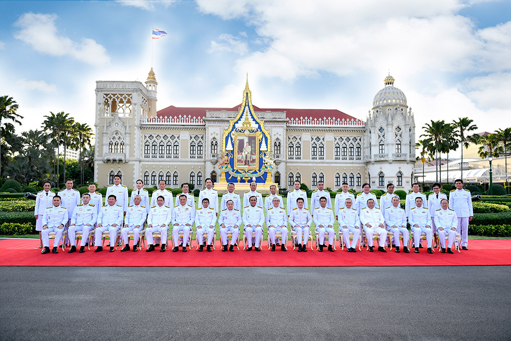 Members of the new cabinet sit for a group photo Tuesday in Bangkok.