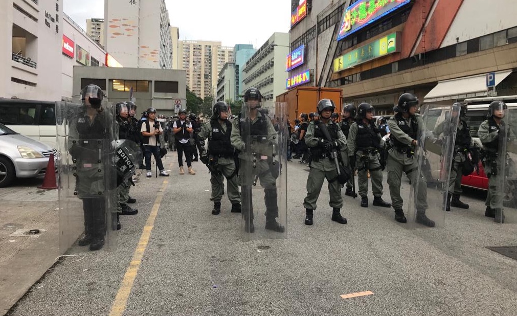Riot police stand in formation in Sha Tin, where an anti-extradition rally took place on Sunday. Photo by Samantha Mei Topp.