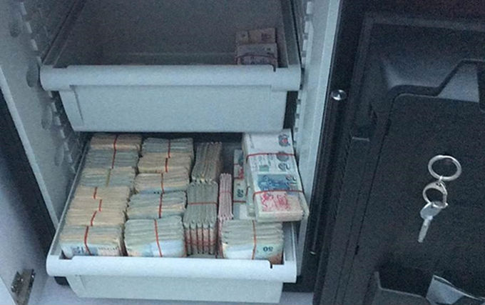 Wads of cash found during raids targeting unlawful remote gambling. (Photo: Singapore Police Force)