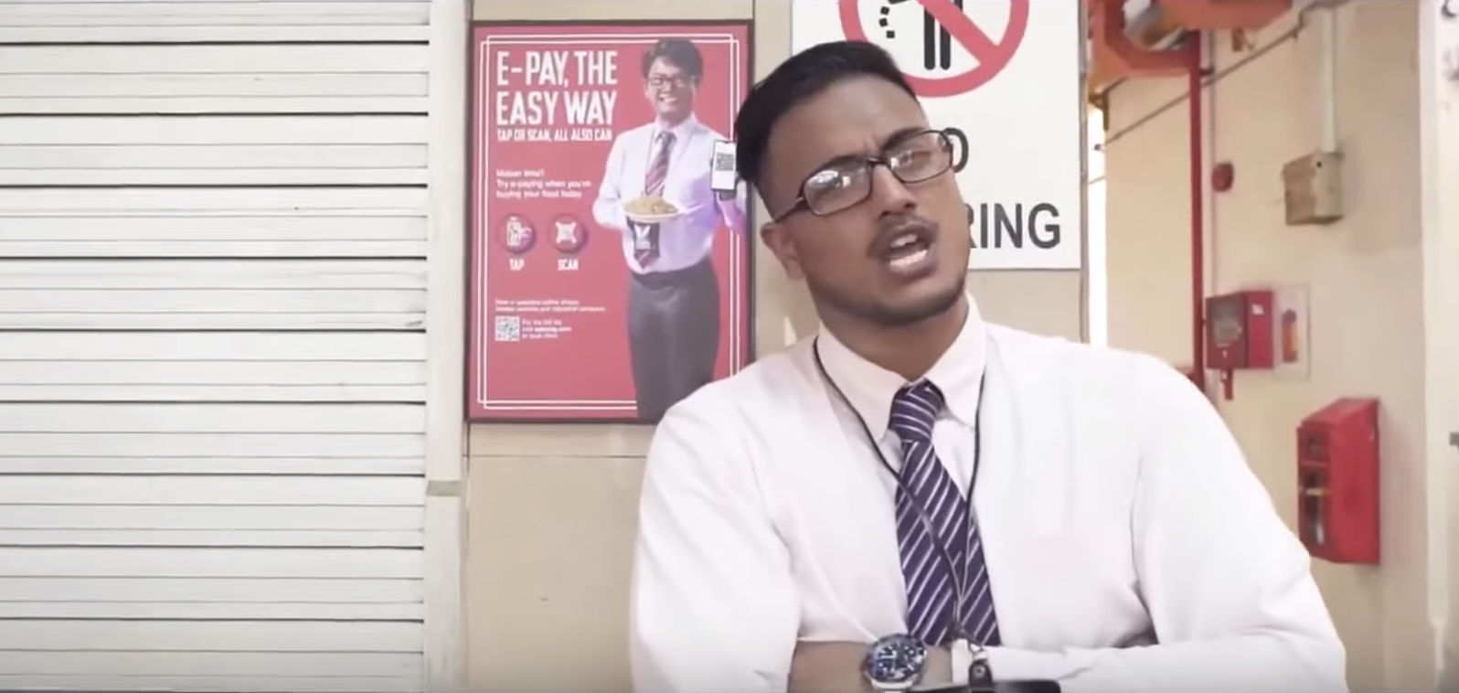 Screenshot of Subhas Nair in rap video made in response to controversial E-Pay ad. 