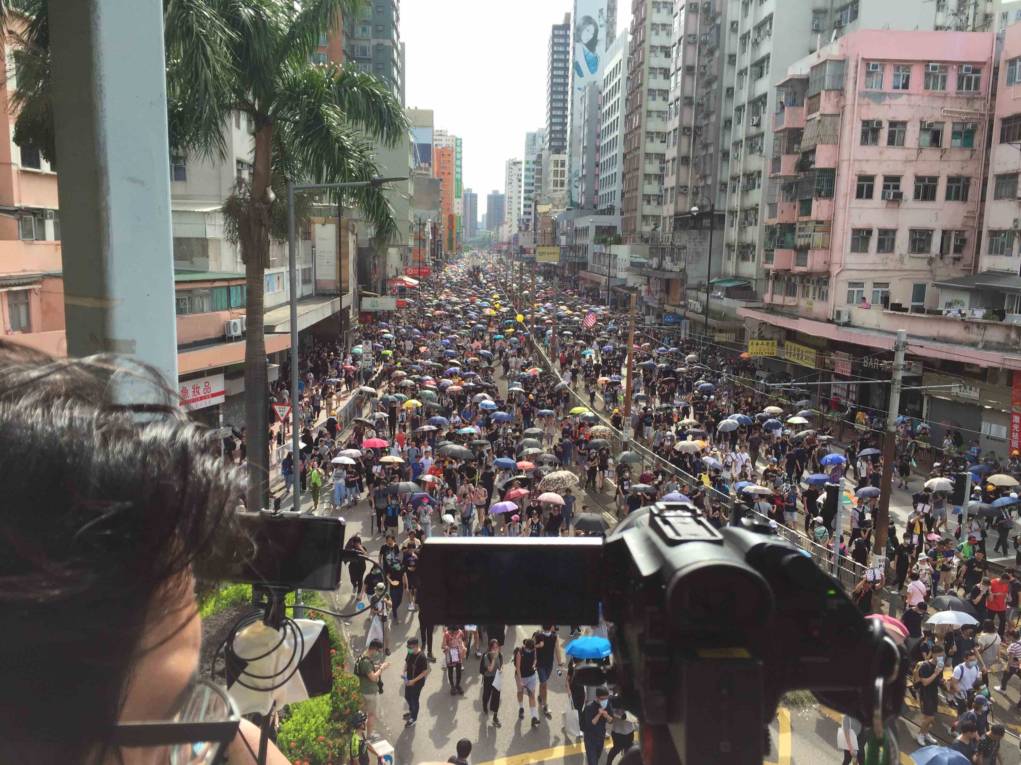 Thousands of protesters crowd Castle Peak Road during an unsanctioned protest in Yuen Long today. Photo by Stuart White.