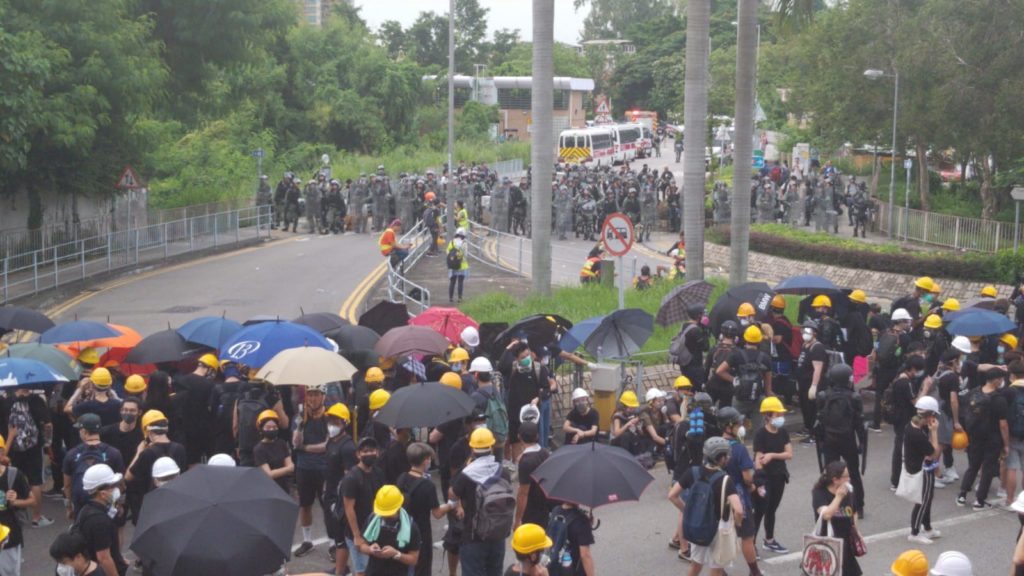 Protesters face off with riot police at an unsanctioned rally in Yuen Long today. Photo by Vicky Wong.