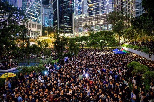 People attend a protest held by civil servants in the Central District of Hong Kong on August 2, 2019, in the latest opposition to a planned extradition law that was quickly evolved into a wider movement for democratic reforms. – Hong Kong civil servants on August 2 night kicked off a weekend of anti-government protests and unsanctioned rallies in defiance of warnings from China and after a prominent independence campaigner was arrested. (Photo by ANTHONY WALLACE / AFP)