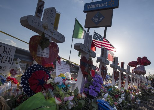 Crosses and flowers at a makeshift memorial for victims of Walmart shooting that left a total of 22 people dead at the Cielo Vista Mall WalMart in El Paso, Texas, on August 5, 2019. <i></noscript> Photo: Mark Ralston/AFP </i>