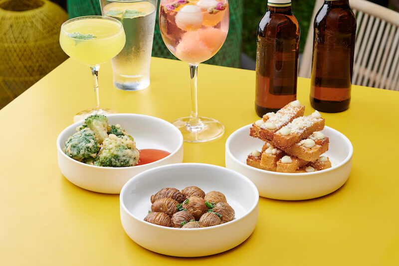 The selection of vegan bar snacks with cocktails. Photo: The Garden Club