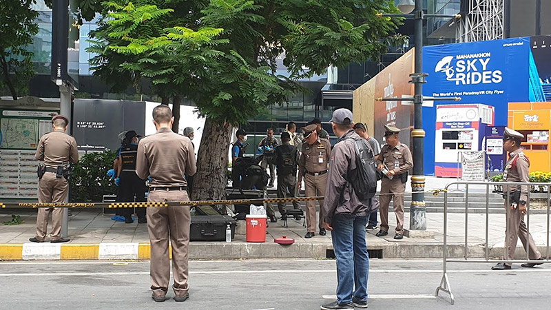Police, EOD and forensics investigators comb through evidence outside the King Power MahaNakhon building at BTS Chong Nonsi on Friday in Bangkok, about an hour after a bomb exploded there. Photo: Coconuts