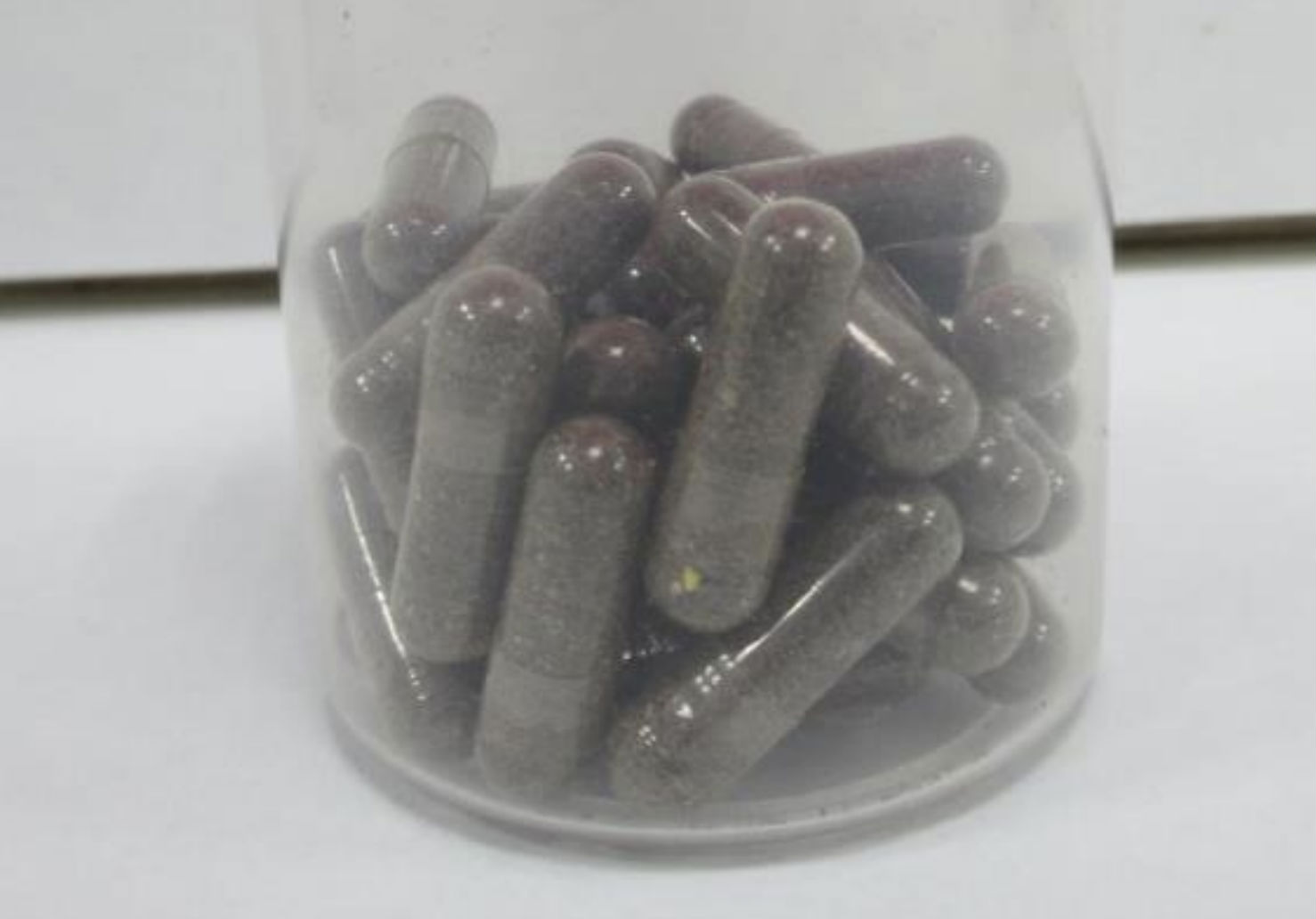 Unlabelled capsules containing brown powder tested positive for steroids. (Photo: HSA)