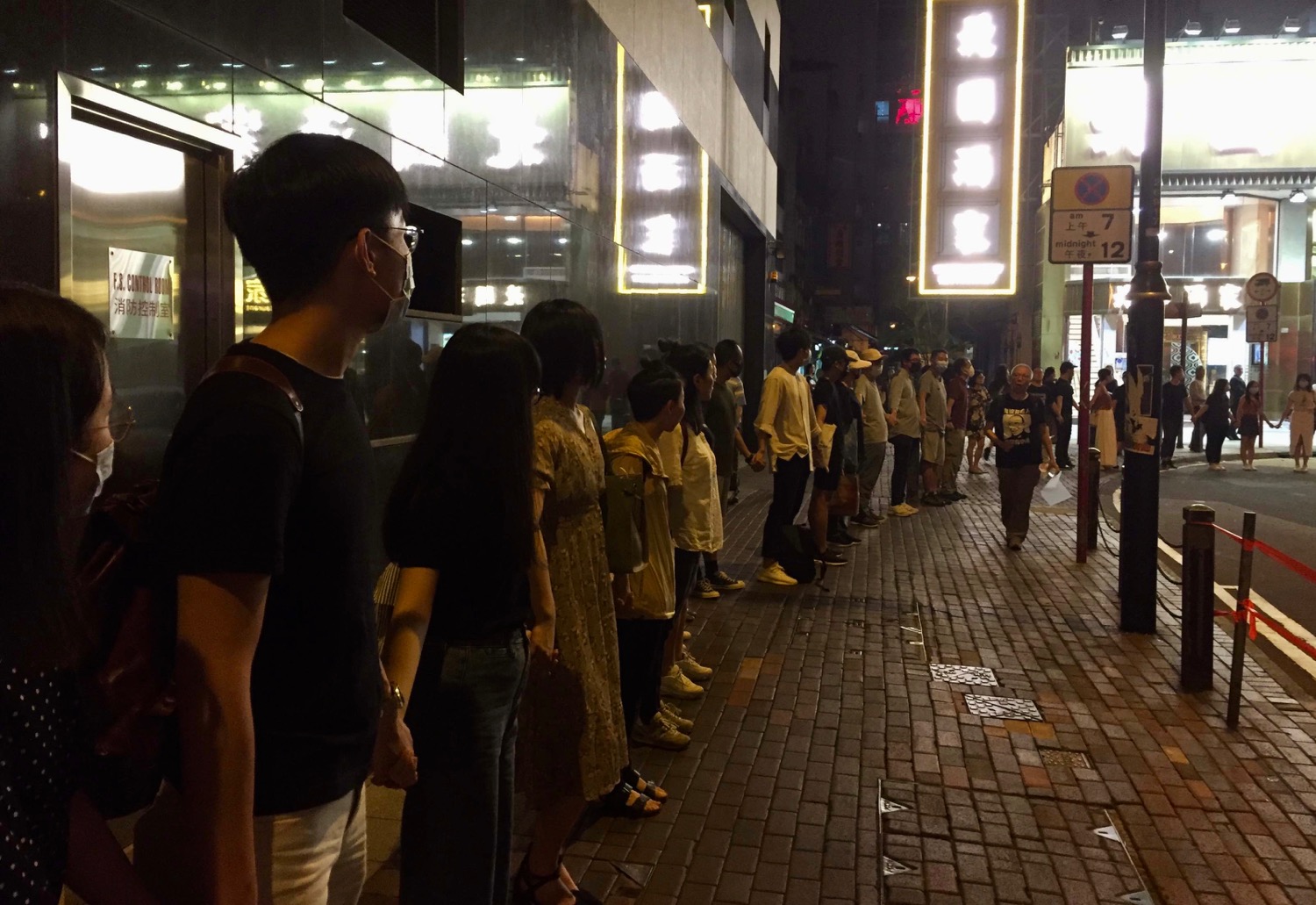 Protesters joined hands across Hong Kong tonight to express their continued support for the city’s long-running protest movement. Photo by Stuart White.