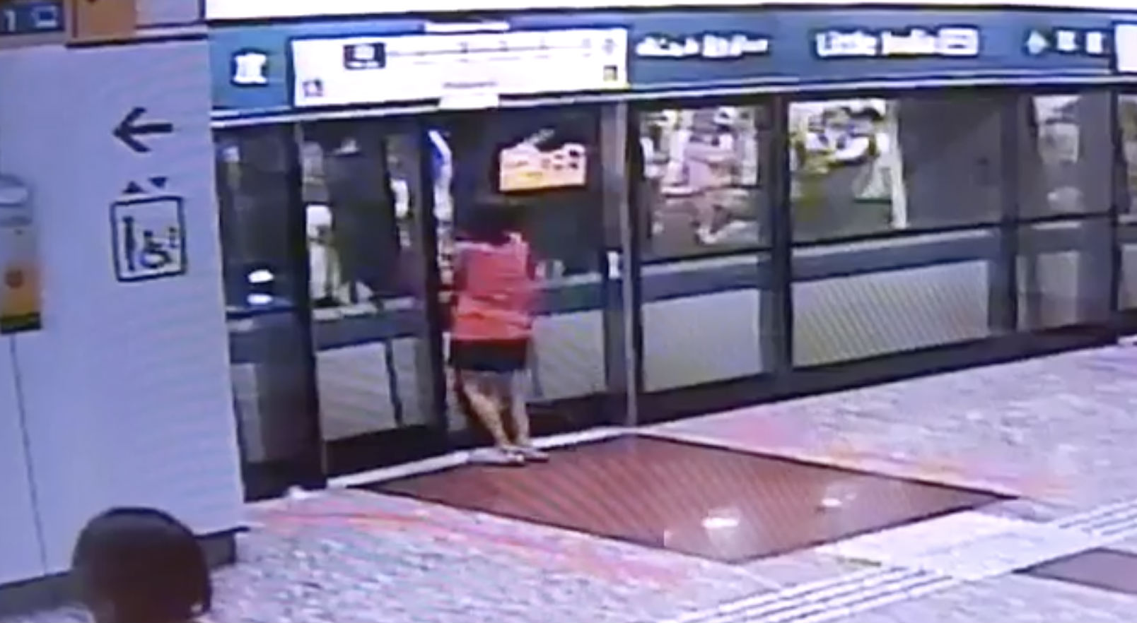 Screenshot of viral video showing woman caught between doors at Little India station. (Photo: All Singapore Stuff/fb)