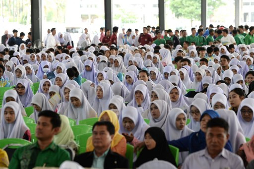 Thai Muslim students and faculties of Princess of Naradhiwas University attend a university sponsored forum presenting various political party candidates in Thailand’s southern province of Narathiwat on March 13, 2019. (AFP/Madaree Tohlala)