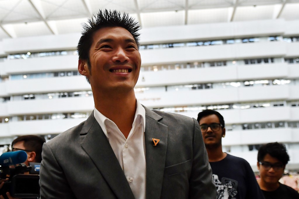 Thanathorn Juangroongruangkit, billionaire leader of opposition Future Forward Party, arrives to face his first hearing over disputed media shares at the Constitutional Court in Bangkok on October 18, 2019. Photo by Lillian Suwanrumpha / AFP
