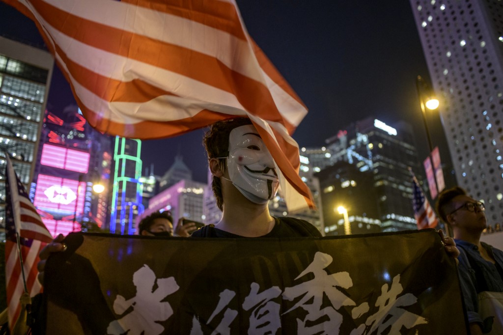 A masked man attends a prayer rally to show support for pro-democracy protesters in Hong Kong on Oct. 19, 2019. Photo via AFP.