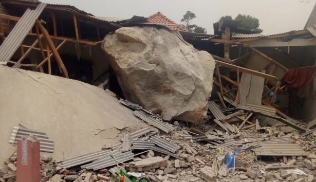A house in a West Java village destroyed after several huge boulders rolled down a cliff near a rock blasting site on October 8, 2019. Photo: Facebook