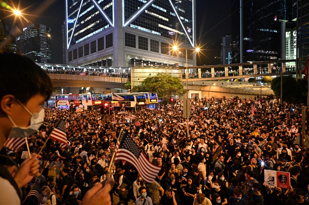 Protesters attend a rally in Hong Kong on October 14, 2019, calling on US politicians to pass a bill that could alter Washington’s relationship with the semi-autonomous city. Photo via AFP.