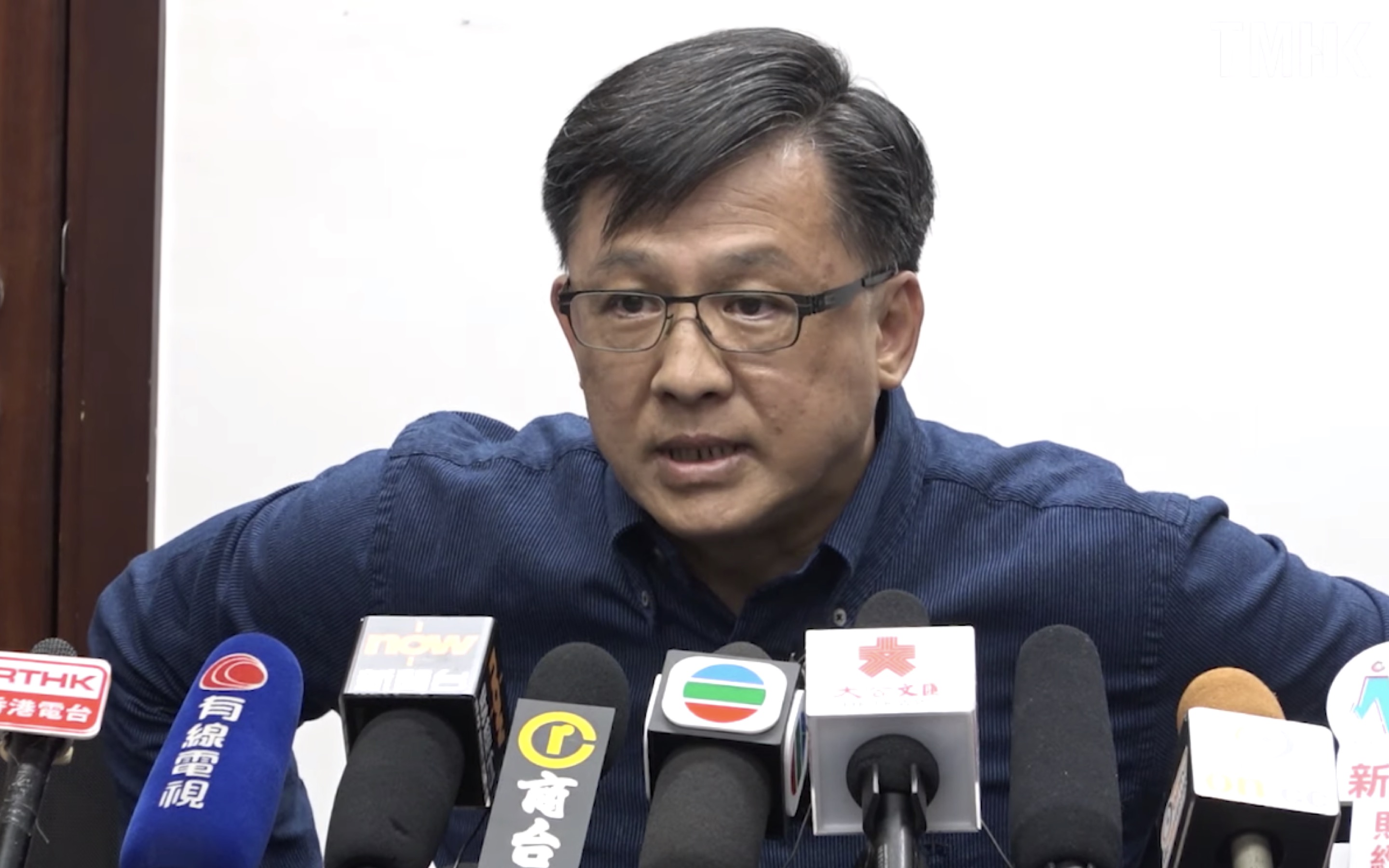 Pro-Beijing lawmaker Junius Ho at a press conference on July 22 where he denied being involved with an indiscriminate attack on pro-democracy supporters, commuters and journalists at Yuen Long MTR station on July 21, 2019. Screengrab via YouTube.