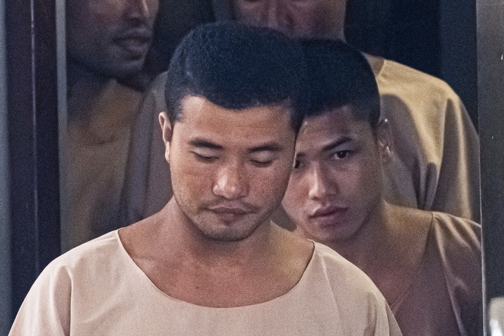 Zaw Lin, at center, and Win Zaw Tun, at right, leave the court on Aug. 29, 2019, in Nonthaburi province after the verdict regarding their conviction for murdering two British backpackers on the holiday island of Koh Tao. Photo: Mladen ANTONOV / AFP
