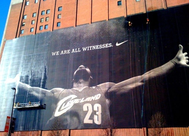 A massive Nike ad featuring Lebron James, when he still played for the Cavaliers, adorns the side of a building in Cleveland. Photo via Flickr/Craig Hatfield.