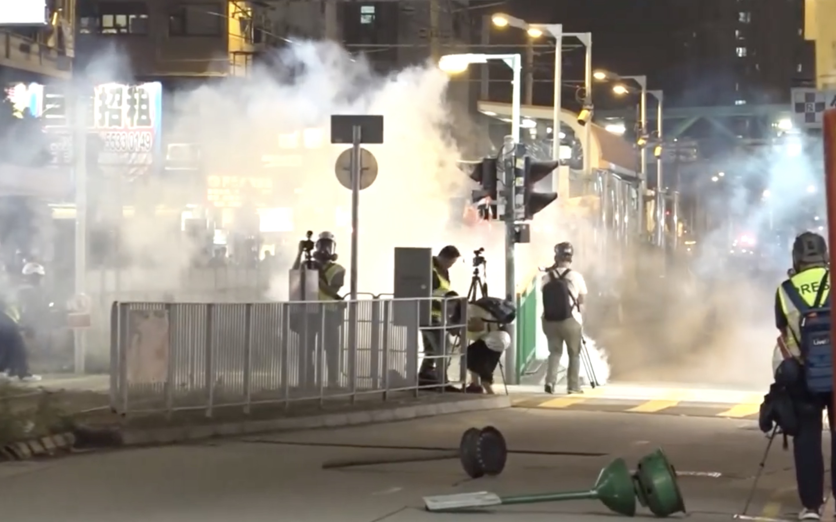 Frontline journalists get caught up in tear gas at a protest marking the third anniversary of the July 21 incident. Screengrab via Facebook/RTHK.