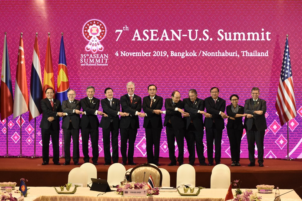 Regional and international leaders on stage together Sunday. Photo: Lillian Suwanrumpha / AFP