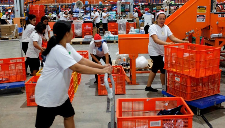 Workers inside Lazada’s warehouse in Cabuyao, Laguna. <i></noscript>Photo: George Calvelo/ABS-CBN News</i>