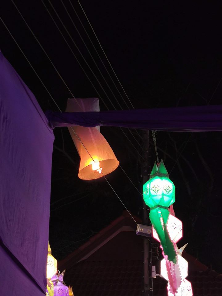 Poser: A lit lantern gets stuck alongside official street decorations. Photo: CM108.com
