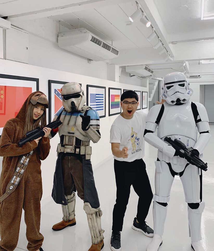 Champ poses for a photo with Star Wars cosplayers