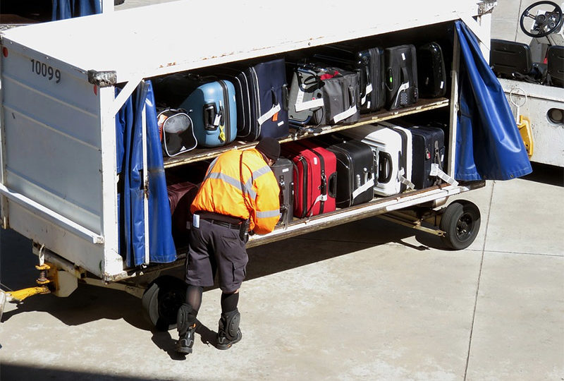 File photo of a baggage handler. Photo: Bonnie Henderson