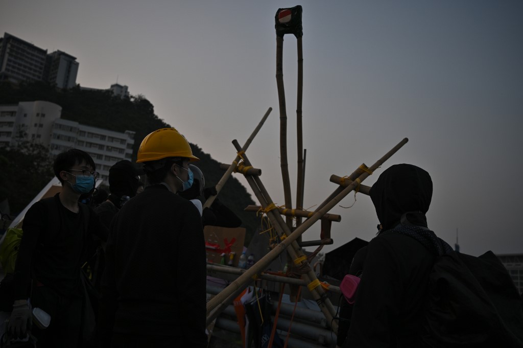 Protesters gather with a catapult made from bamboo at the Chinese University of Hong Kong on Nov. 13, 2019. Photo via AFP.