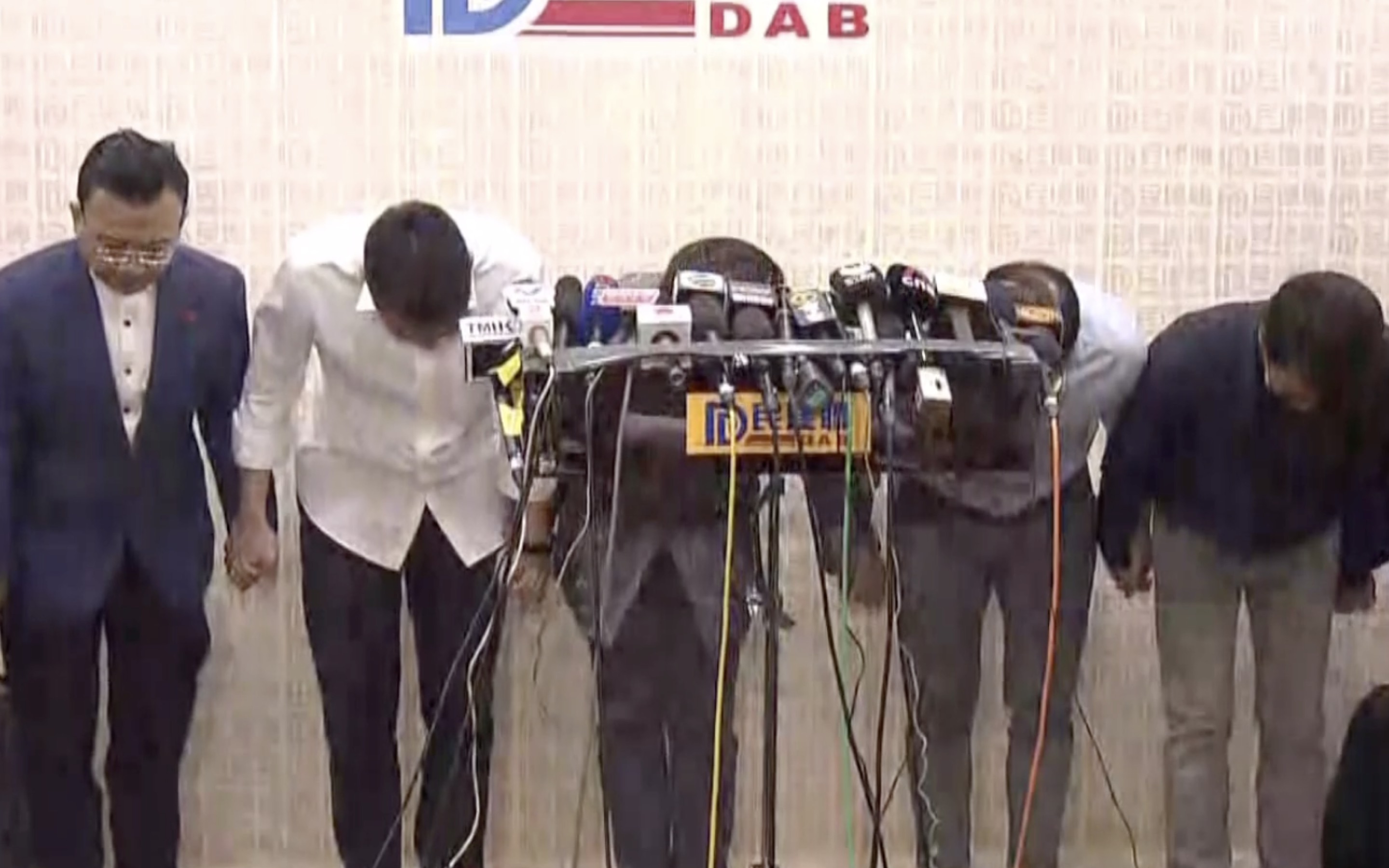 Members of the largest pro-Beijing party the DAB bow after conceding defeat at the polls at the 2019 district council elections. Screengrab via Facebook/Now TV News.