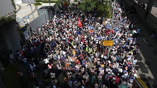 Supporters of the Hong Kong Police Force participate in a pro-law enforcement rally outside the Legislative Council building in Hong Kong on Nov 16, 2019. (Photo: AFP)