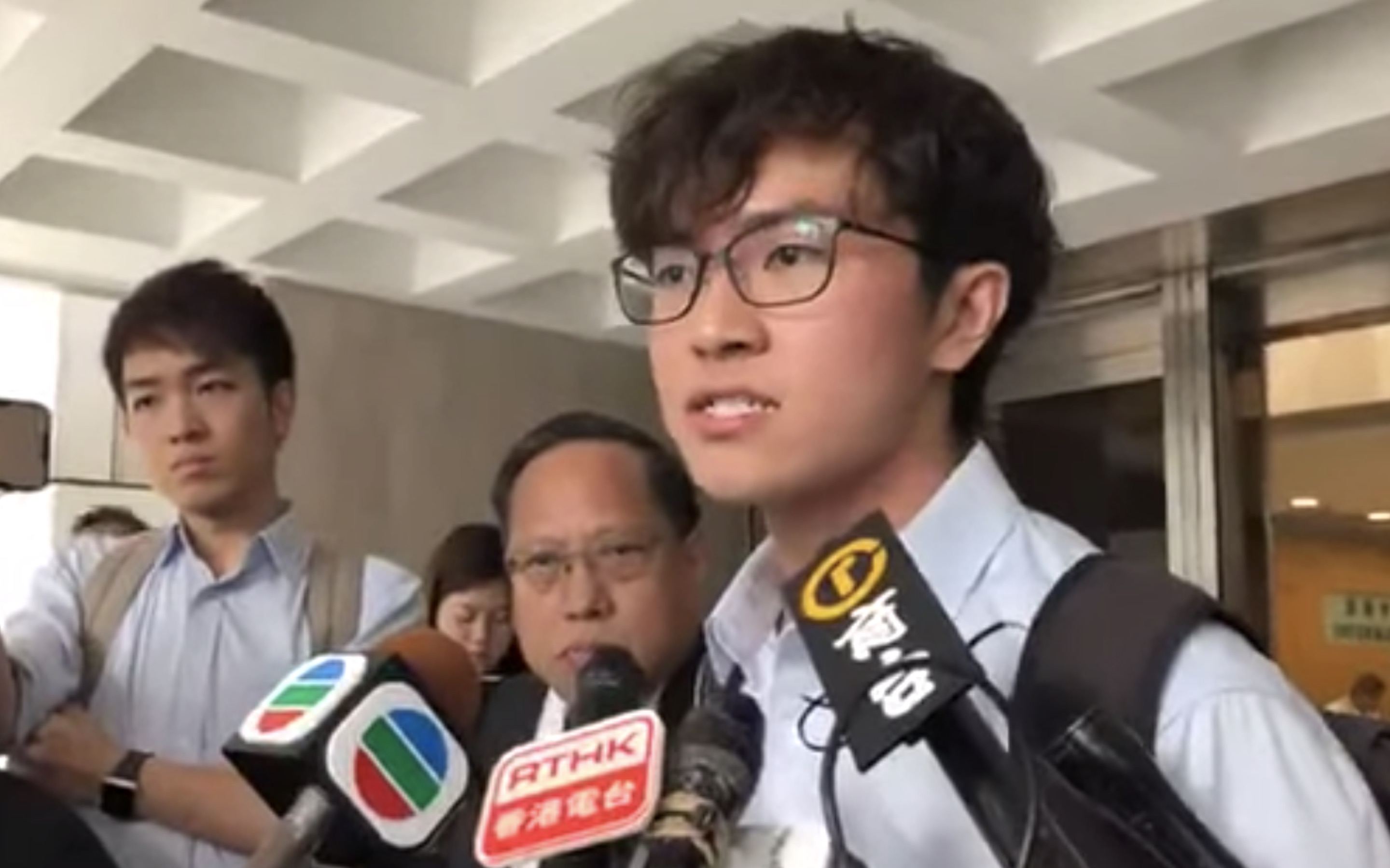 Chinese University of Hong Kong student union president Jacky So addresses reporters shortly after applying for an interim injunction to ban police from entering campus without a warrant following a night of intense clashes on campus.