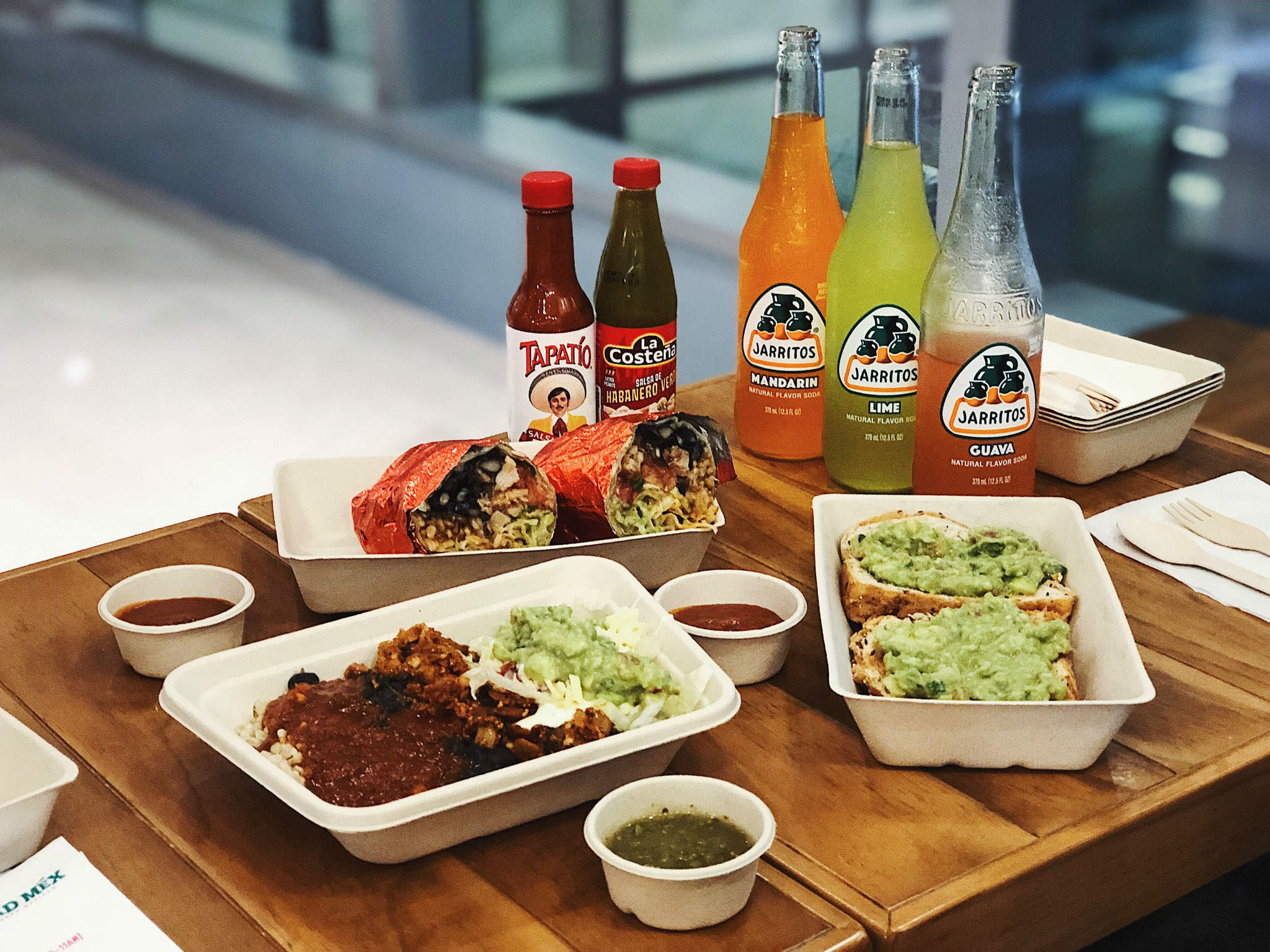 Burritos, naked burritos, and beverages at Mad Mex. Photo: Coconuts Singapore