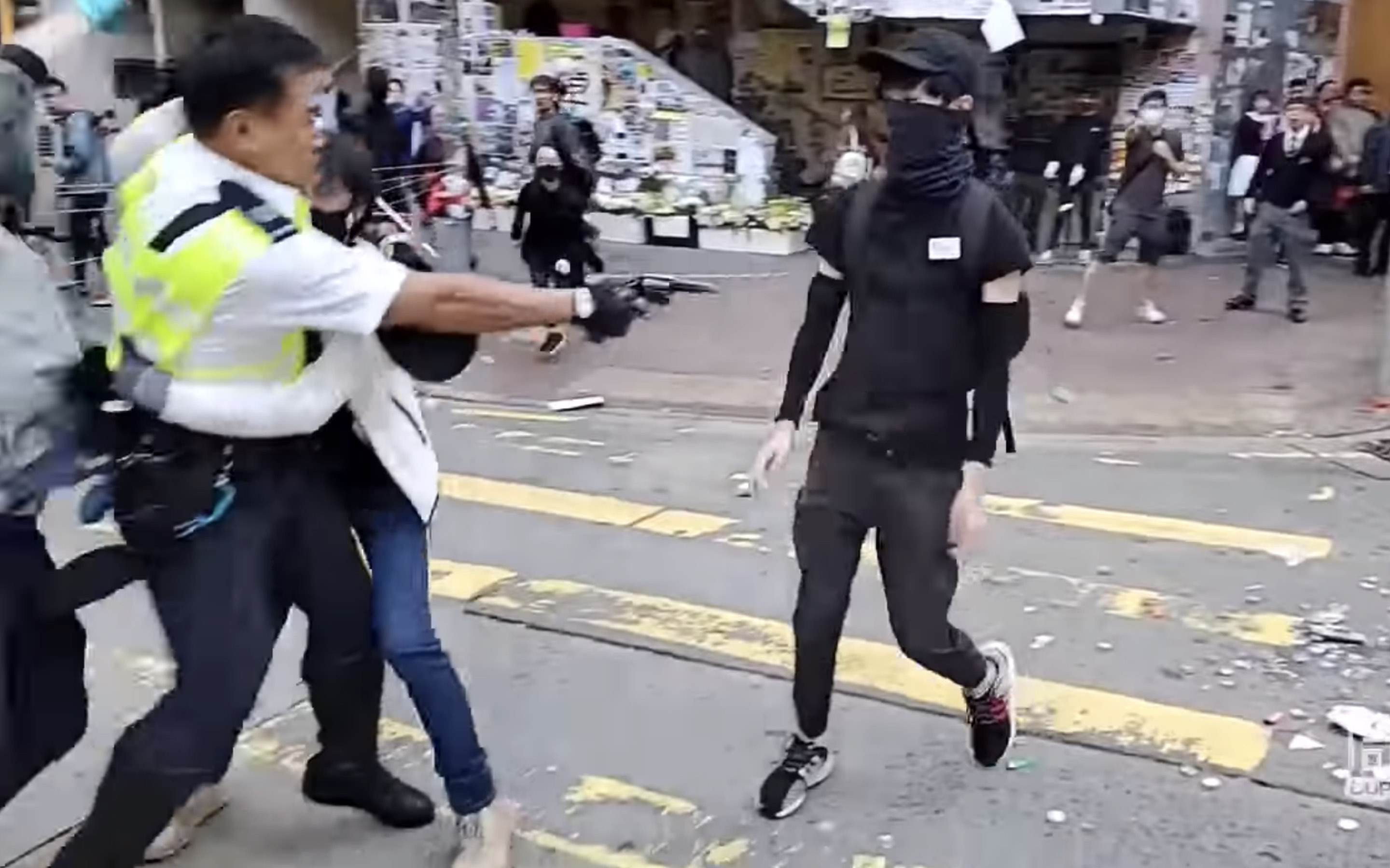 The moment a police officer shot a 21-year-old protester in the abdomen. Screengrab via YouTube.
