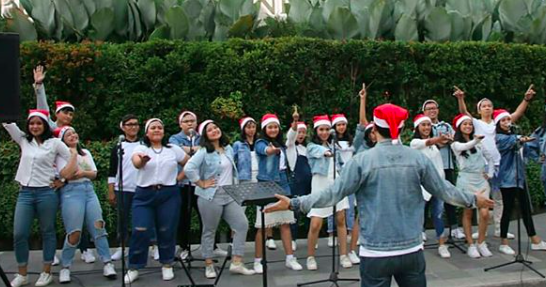 A Christmas carol group performing in front of the Grand Hyatt in Central Jakarta on Dec. 18, 2019. Photo: Instagram/@christmasinjakarta