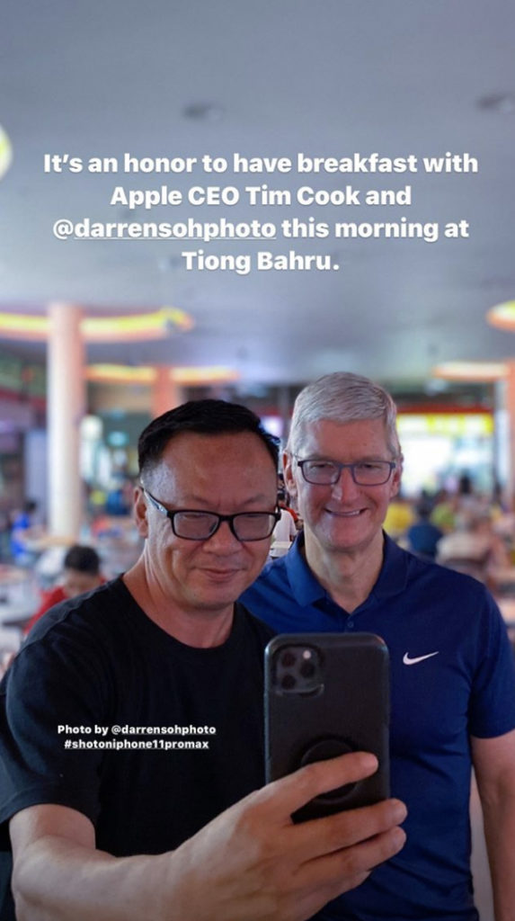 Singapore street photographer Aik Beng Chia takes a photo with Apple CEO Tim Cook. Photo: Aik Beng Chia/Instagram