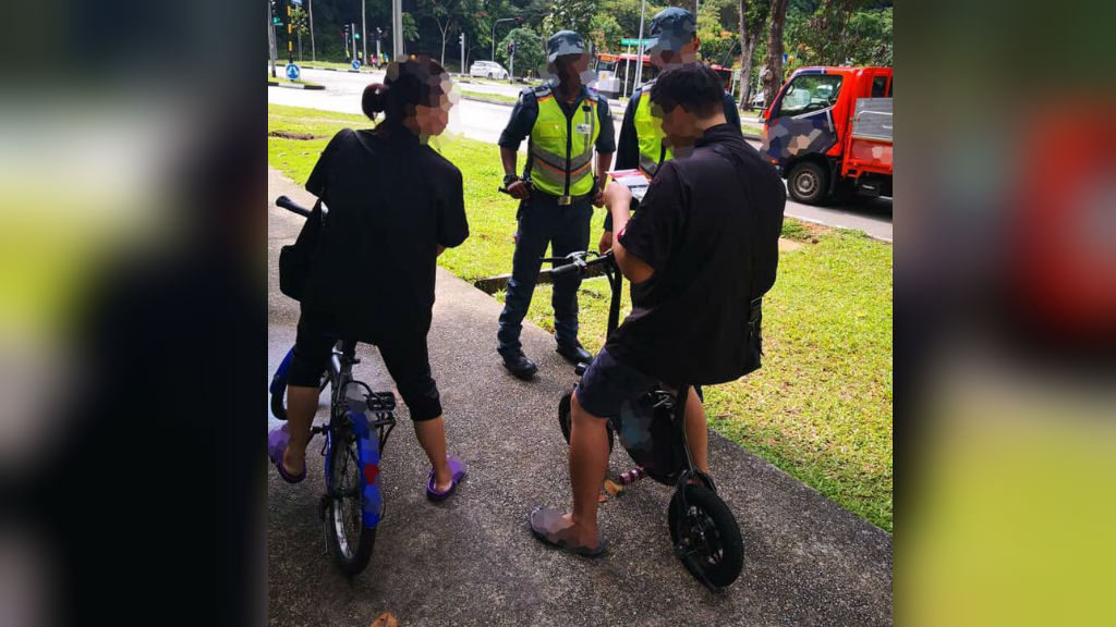 E-scooter riders stopped by authorities. Photo: Land Transport Authority/Facebook
