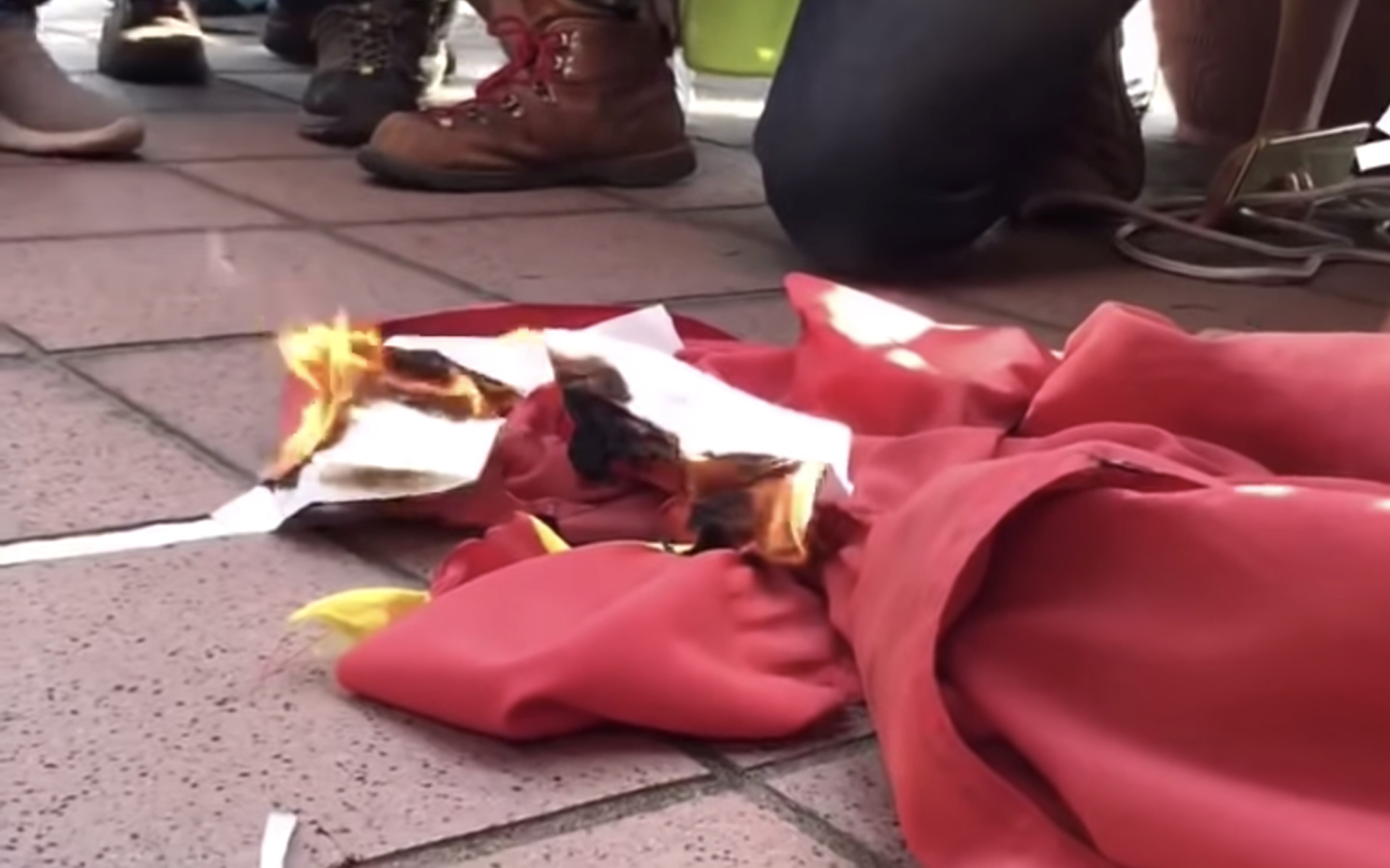The moment protesters set the Chinese national flag on fire on September 21, 2019. Screengrab via YouTube.