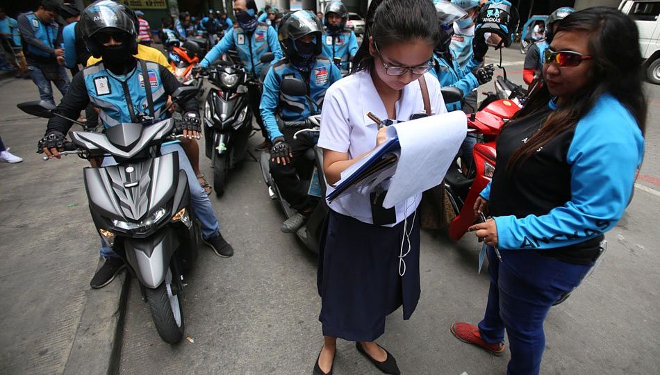 Student signs up for free Angkas ride in Oct 2019 after LRT2 suspended operations because of fire damage. <i></noscript>Photo: ABS-CBN News</i>