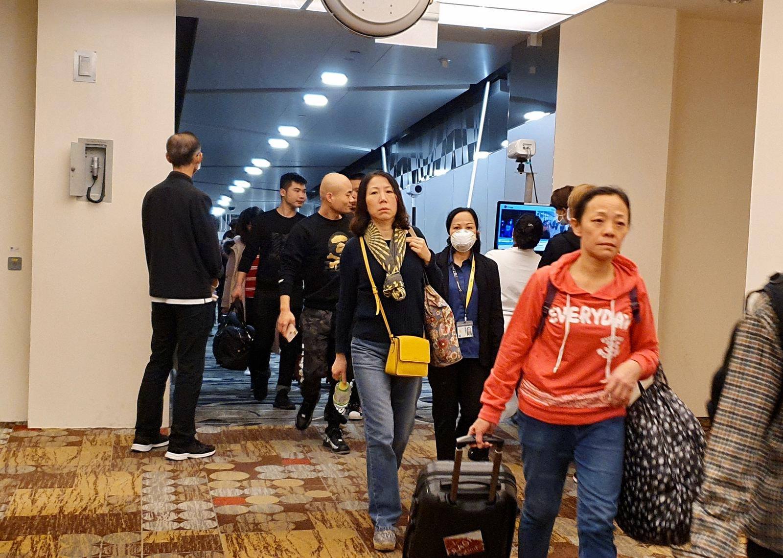 Travelers arriving from Wuhan, China, are scanned for elevated body temperatures at Changi Airport. Photo: Khaw Boon Wan/Facebook
