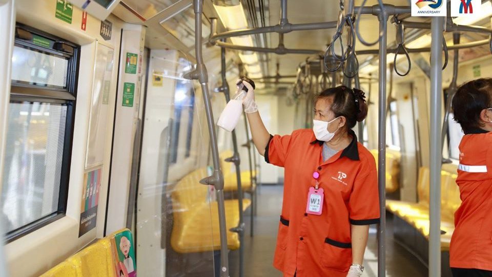 
An employee sprays disinfectant inside a BTS Skytrain car to fight the spread of the virus. Photo: BTS Skytrain / Facebook
