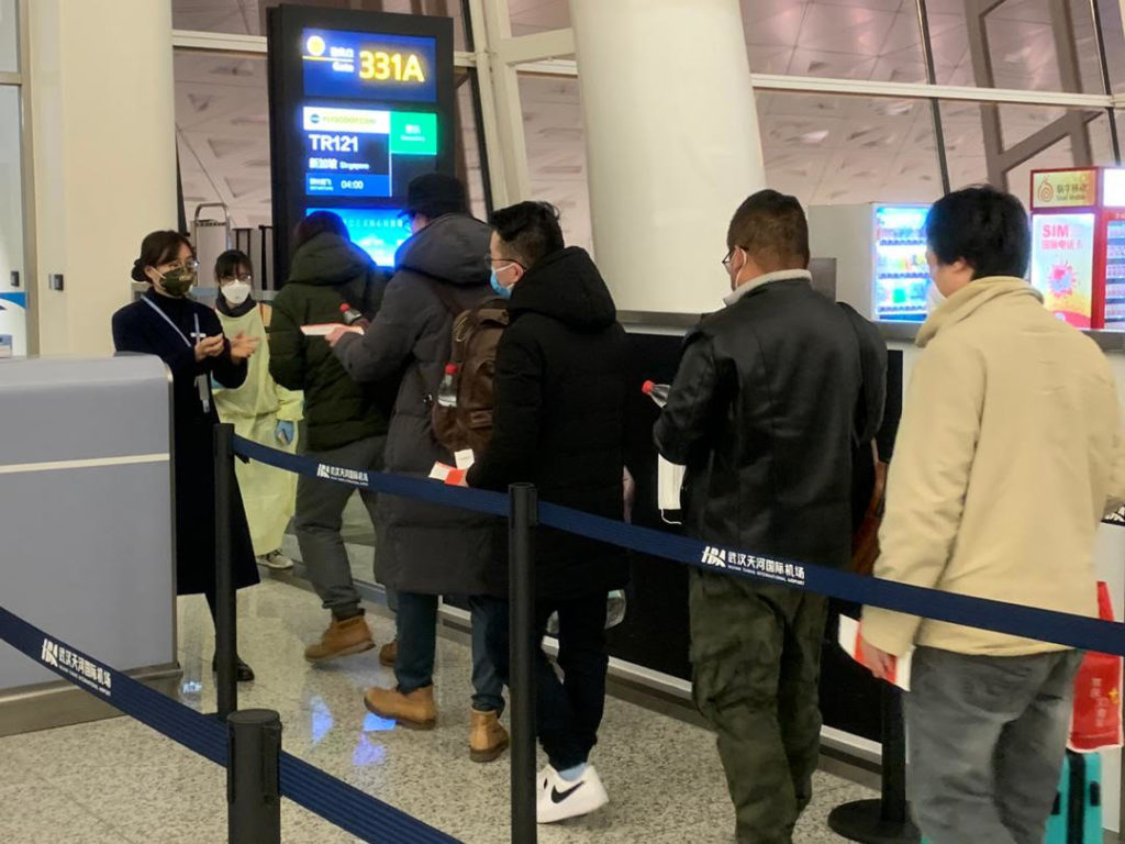 Singaporeans queueing up at Wuhan Tianhe International Airport to board flight to return home. Photo: Singapore Foreign Affairs Ministry
