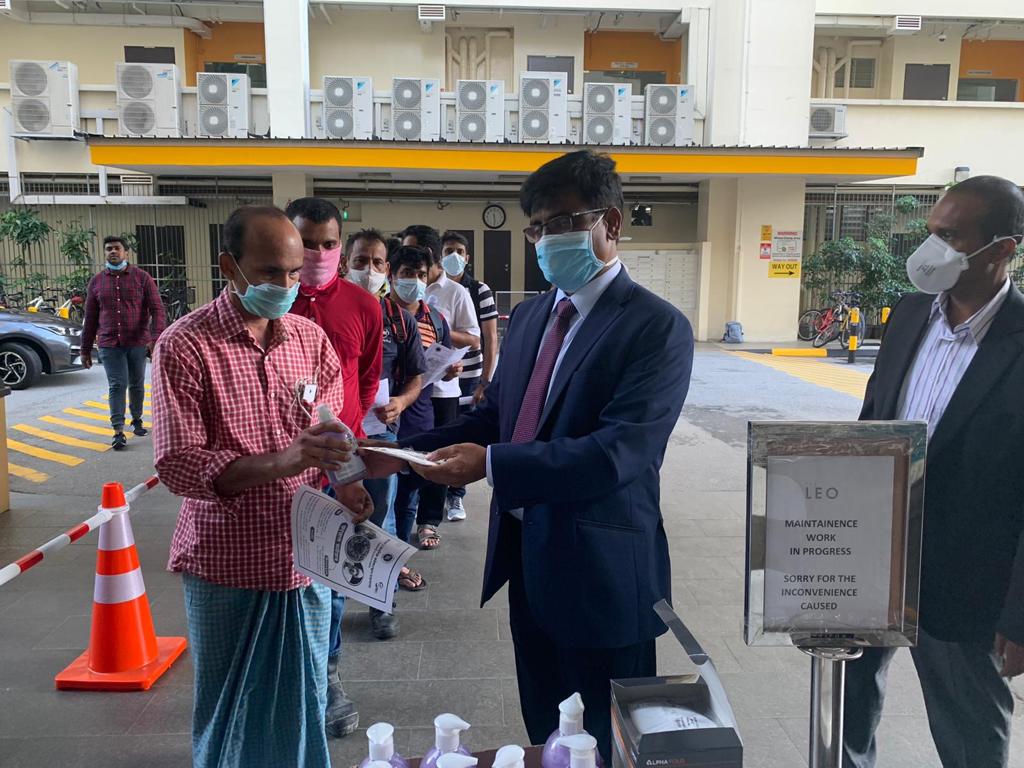 Masks and hand sanitizers being distributed at The Leo dormitory. Photo: Bangladesh High Commission, Singapore/Facebook